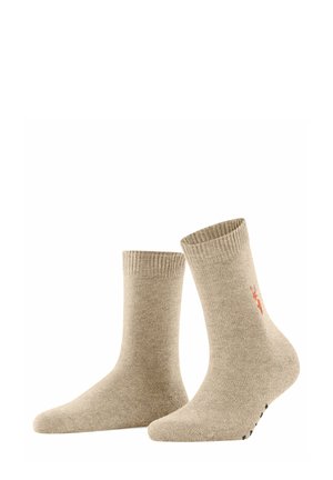 Calzini di cotone beige con polsini a coste, caratterizzati da un design ricamato e dettagli antiscivolo sulla suola. Lunghezza a metà polpaccio.