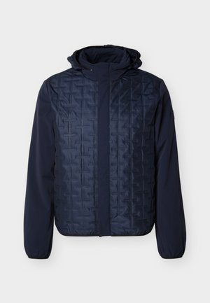 Navy blue men's jacket with quilted front panel, smooth long sleeves, elastic cuffs, and attached hood, shown on white background.