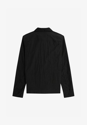 Camicia nera a maniche lunghe con finitura testurizzata, colletto classico e design a taglio dritto. Presenta polsini con bottoni e cucitura sul dietro.