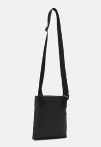 Calvin Klein Jeans MONOGRAM SOFT FLATPACK UNISEX - Borsa a tracolla - black