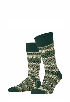 Chaussettes mi-mollet vertes et beiges à motifs géométriques et en zigzag avec bordures, talons et orteils unis vert foncé.
