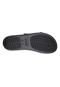 Black rubber shoe sole with a textured tread pattern and grooves for traction. Features embossed brand logo and size markings.