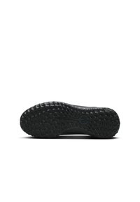 La suola della scarpa da ginnastica nera presenta un design in gomma testurizzato con motivi di presa arrotondati e un emblema centrale. Bordo liscio e costruzione solida.