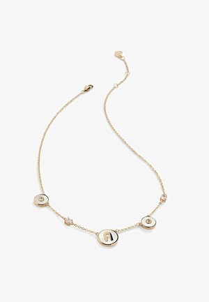 Kuldtooniga kaelakee, millel on ümmargused ripatsid, millest kaks sisaldavad vääriskivi ja üks on tähistatud tähega "A". Peen kett konstruktsioon koos peente aktsentidega.