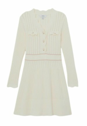 Ríhované pletené šaty v krémovej farbe, s výstrihom do V, prednými gombíkmi a dvoma náprsnými vreckami. Priliehavý živôtik s rozšírenou sukňou. Mäkká textúra.