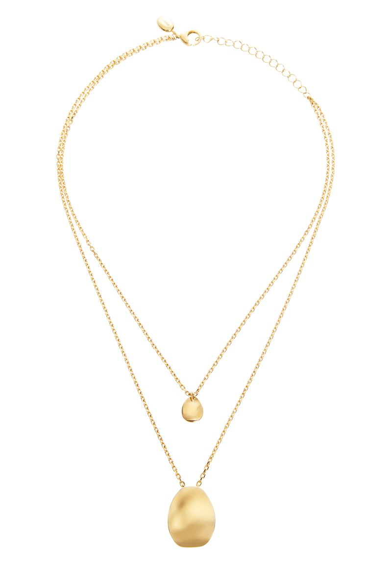 Złocona podwójna naszyjnik z owalnym wisiorkiem i mniejszym wisiorkiem w kształcie kropli, o gładkiej fakturze i cienkim łańcuszku.
