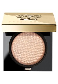Bobbi Brown pressed powder in a round compact. Gold lid with embossed logo, black base, and textured, light beige powder inside.
