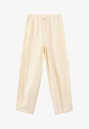 Pantalones holgados de color crema con cinturilla elástica y cordón, con paneles decorativos de encaje con ojales a lo largo de ambos laterales exteriores.