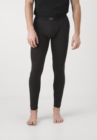 Black leggings with a smooth texture and fitted design. Features a contoured pouch and a comfortable waistband. No visible patterns or accents.