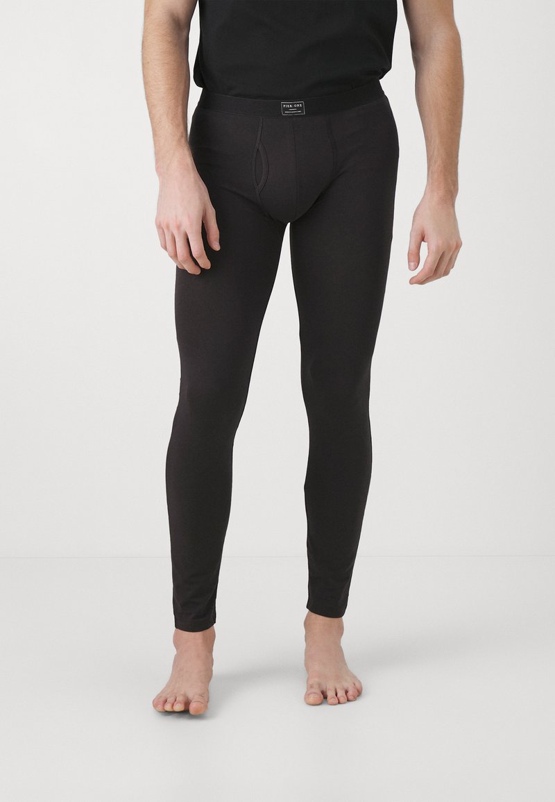 Black leggings with a smooth texture and fitted design. Features a contoured pouch and a comfortable waistband. No visible patterns or accents.