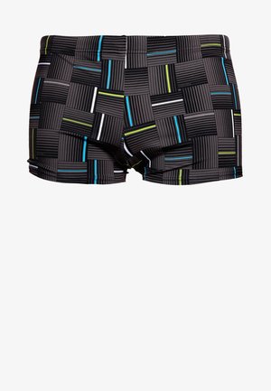 Swim trunks in a black base featuring a grid pattern with raised lines and contrasting stripes in blue, green, and white. Stretch fabric.