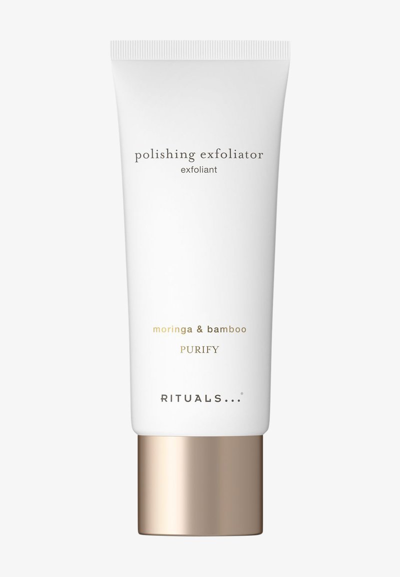 Tube blanc de gommage polissant Rituals avec moringa et bambou, bouchon de couleur or, étiqueté "Purify" sur un fond uni.