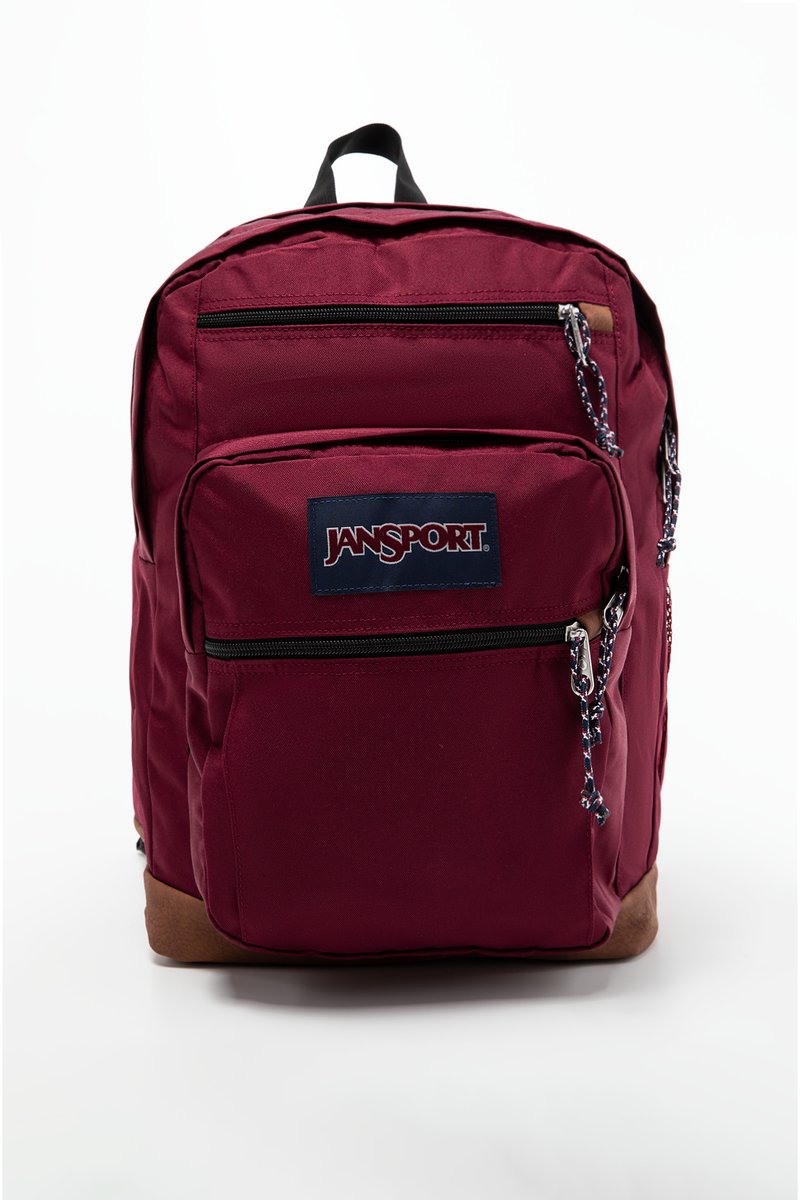 Sac à dos bordeaux avec plusieurs poches zippées, en tissu, avec patch logo, zips noirs et accent inférieur marron. Dispose de bretelles rembourrées.