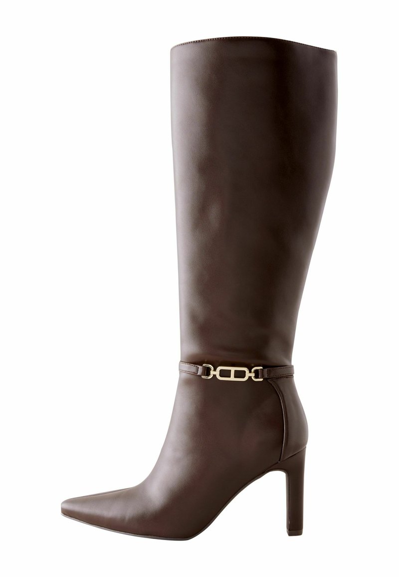 Brown leather knee-high boot with pointed toe, block heel, and decorative gold chain detail around the ankle.
