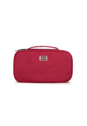 Rectangular red cosmetic bag with a textured surface, silver logo plaque, and a top handle, featuring a zip closure.