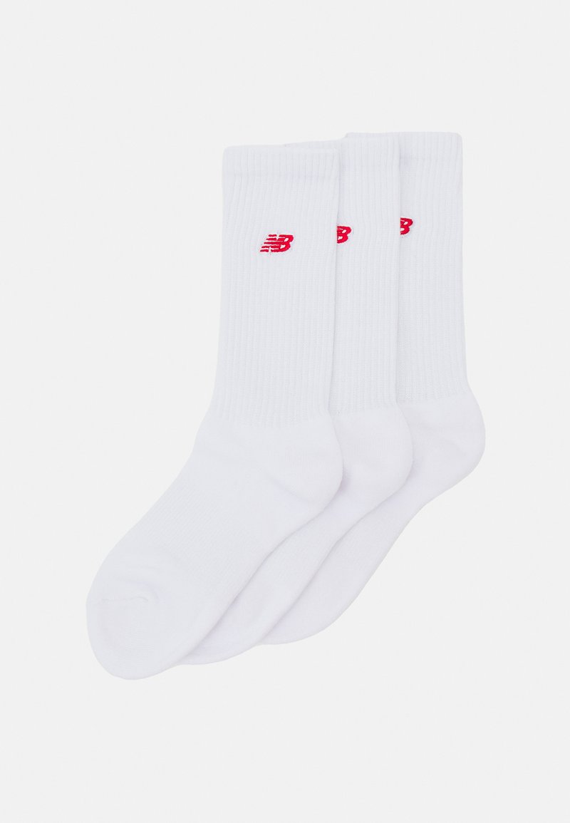 White athletic socks in a ribbed design, featuring red New Balance logo, three pairs bundled, soft fabric, mid-calf length.