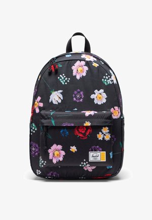 Sac à dos noir avec imprimé floral coloré, poche avant, poignée supérieure et petite étiquette blanche de la marque Herschel en bas à droite.