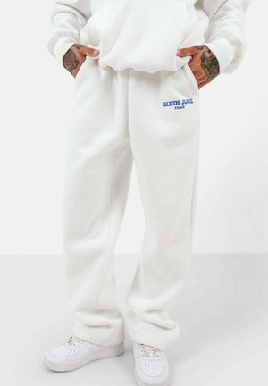 RETRO - Tracksuit bottoms - white