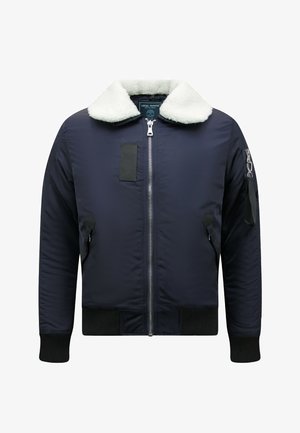 Marineblauw bomberjack met witte nepbontkraag, ritssluiting aan de voorkant, een zijzak met rits op de mouw en geribde boorden en zoom.
