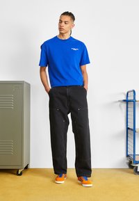Carhartt WIP NASH PANT SMITH - Relaxed fit jeans - black stone washed