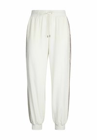 Pantalons de survêtement blancs avec taille élastique et cordon de serrage. Comprend des accents latéraux avec un bord décoratif et des poignets aux chevilles. Texture douce.