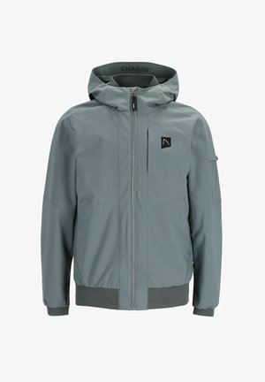 Sivi jakna sa kapuljačom, potpuno se zatvara na zip, s rastezljivim manžetama i džepom na lijevoj strani grudi. Ima oznaku s logotipom.