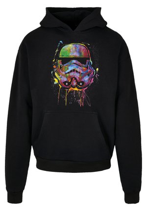 Black hoodie featuring a colorful, graphic print of a stormtrooper helmet with splatter effects in vibrant hues. Front pocket and ribbed cuffs.