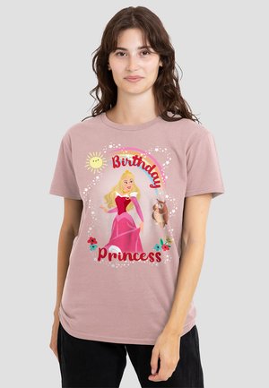 Light pink cotton t-shirt featuring a graphic of a princess holding an owl, surrounded by a rainbow and the text "Birthday Princess."
