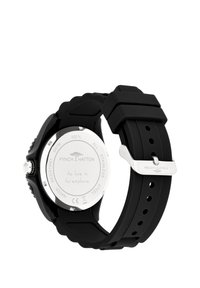 Schwarze Silikonarmbanduhr mit einem Gehäuseboden aus silbernem Edelstahl, ausgestattet mit einem strukturierten Muster am Armband und graviertem Text auf der Rückseite.
