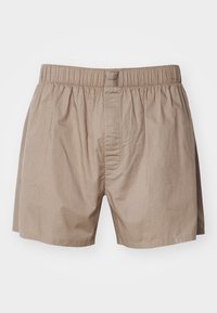 Boxeri din bumbac bej, cu un waistband elastic, prezentând un zăvor cu buton și detalii de cusătură subtile pentru un plus de textură.