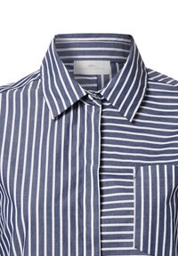 Navy and white striped button-up shirt featuring a front pocket, crisp collar, and contrasting stripe widths throughout the fabric.