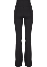 Sorte flared tights med høy midje, laget av elastisk stoff. Glatt tekstur uten synlige mønstre eller metall detaljer.