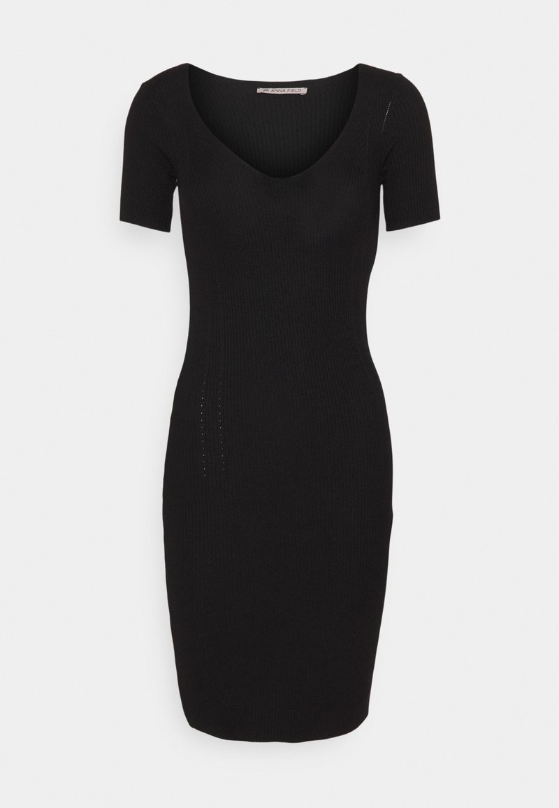 Robe bodycon tricotée noire avec un décolleté en V profond et des manches courtes. Présente des détails latéraux discrets et une silhouette ajustée.