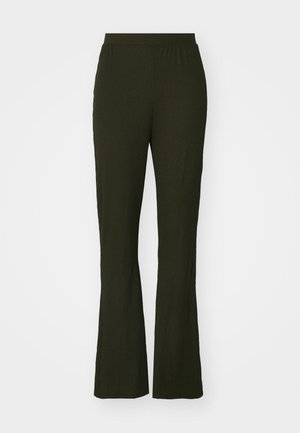 Tumedat rohelised, laienevad püksid elastse vöökohaga. Valmistatud tekstureeritud kangast, neil on vabalt liikuv lõige ja täispikk disain.