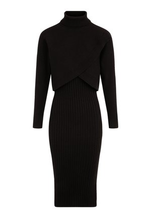 Abito a coste nere con collo alto, maniche lunghe e un design asimmetrico con top corto. Silhouette aderente.