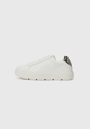 White sneaker with smooth leather upper, round toe, and thick sole. A textured snake-patterned detail at the heel adds visual interest.