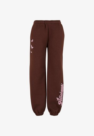 Braune Sweatpants mit lockerer Passform, featuring einen Kordelzugbund, bestickten Schmetterlingen in Pink und dem Text "Delicious" entlang des Beins.