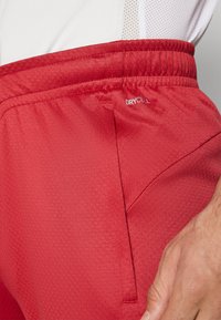 Puma GALATASARAY ISTANBUL TRAINING PANTS - Fanartikel - red rhythm/intense orange