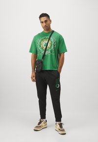 Nike Performance NBA BOSTON CELTICS JOGGERS - Tracksuit bottoms - black