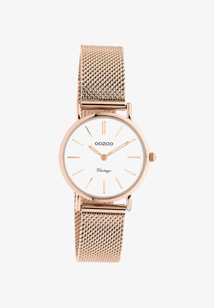 Montre-bracelet OOZOO Vintage en or rose avec cadran blanc, index en or rose et bracelet en maille, indiquant l'heure 10h10.