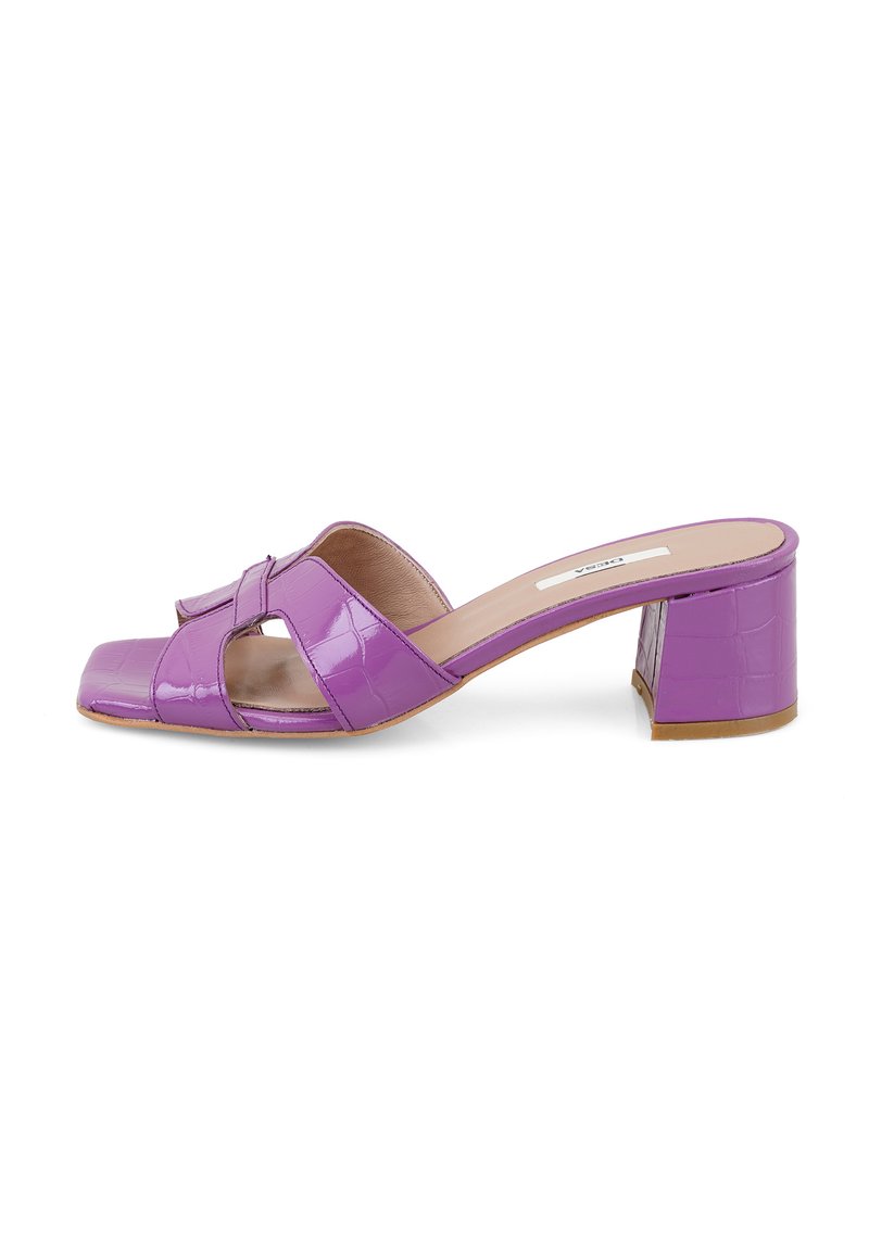 Purple patent leather mule, featuring a square toe, open front with crisscross straps, and a chunky heel. Textured finish with a glossy sheen.