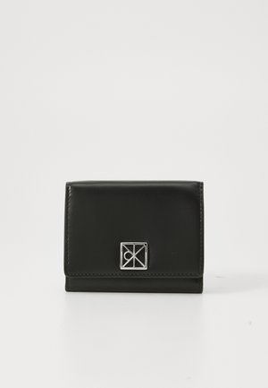 Black leather wallet with a silver geometric emblem on the front, placed against a plain white background.