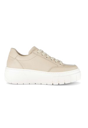 Beige low-top sneaker with thick white platform sole and matching beige laces, shown in side profile on white background.