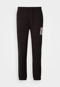 PAINTED - Pantaloni sportivi - black