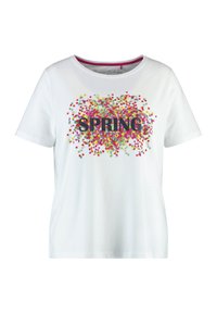Weißes Baumwoll-T-Shirt mit kurzen Ärmeln, das ein buntes Konfetti-Muster und das Wort "FRÜHJAHR" in fettem schwarzen Text auf der Vorderseite zeigt.