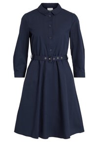 Mörkblå klänning av bomull med krage, knappstängning fram, långa ärmar och midja med bälte. Utskuren kjol med en slät textur.