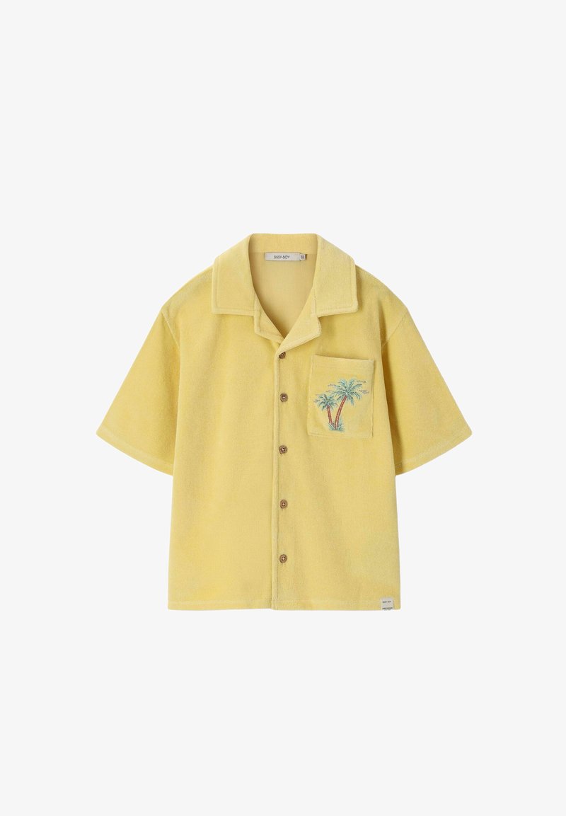 Chemise boutonnée à manches courtes en tissu éponge jaune avec col à revers et broderie d'un palmier sur la poche poitrine gauche.