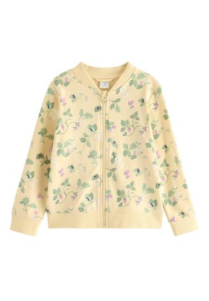 Gul børnejakke med lynlås, ribstrikket krave og manchetter, dekoreret med grønne blade, lyserøde blomster og bi-mønstre over det hele.