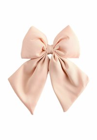 Un nœud en tissu rose clair avec un nœud central, comportant de larges boucles fluides et une texture lisse. Convient pour les accessoires capillaires.