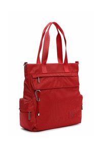 Red textured tote bag with double handles, front zip pocket, side pouch, and metal zipper pulls, standing upright on a white background.